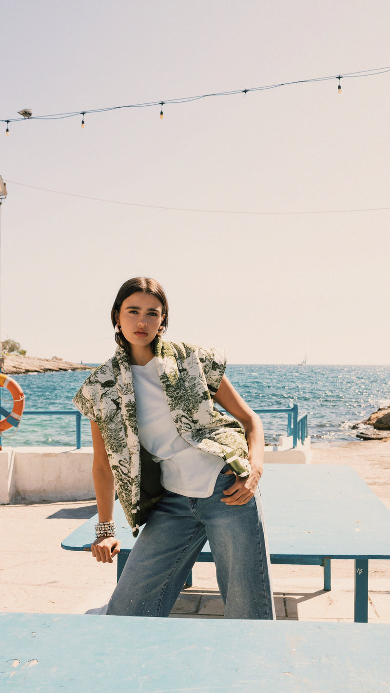 Woman wearing colorful striped crochet sweater from Have we met before? collection of Cache Cache Clothing